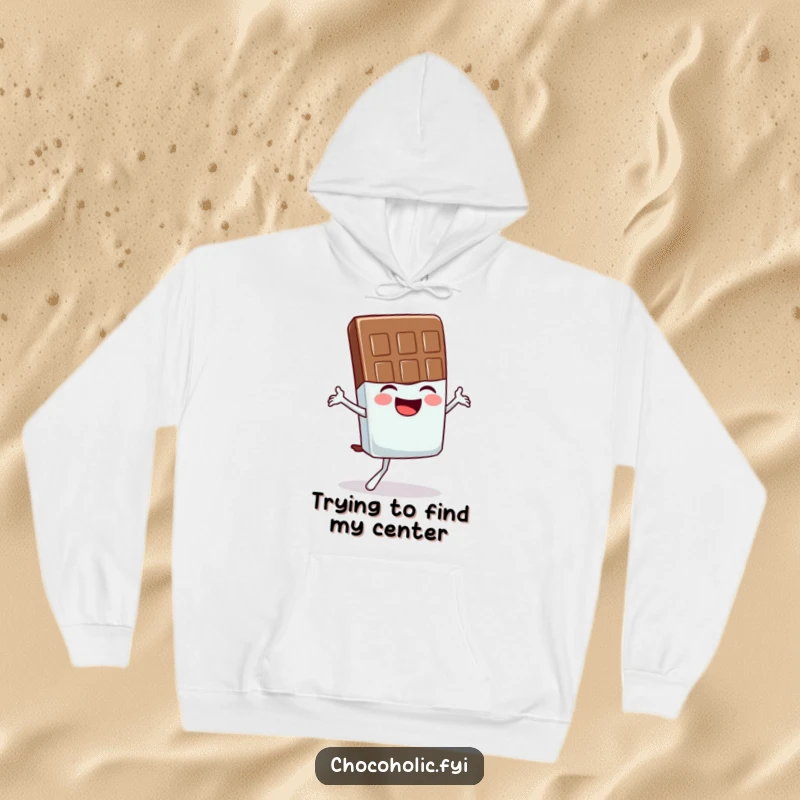 Funny hoodie showcasing a gleeful chocolate bar character wobbling precariously while attempting a yoga pose, looking amused.